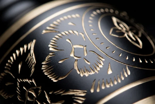Close-up of the black finish and gold hand-engraved band