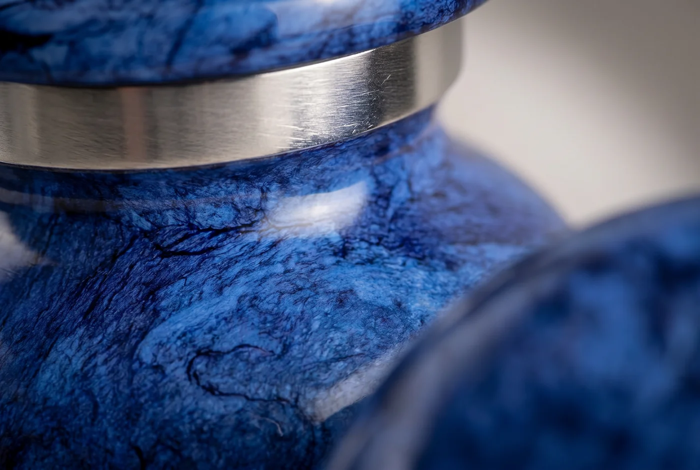 Close-up of the blue marble finish and silver band