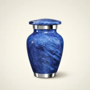 Deep blue marble small keepsake urn with silver bands, studio shot
