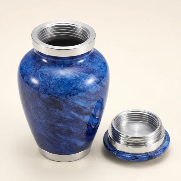 Blue marble keepsake urn with the threaded lid removed