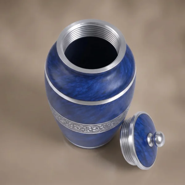 Blue Marble cremation urn open, silver thread inside, lid beside