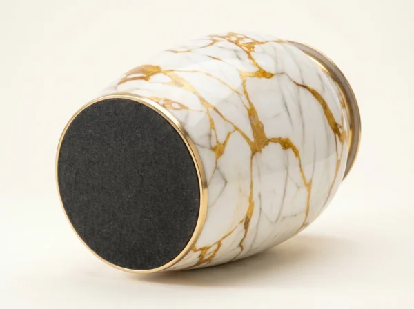 gold marble cremation urn base with protective charcoal felt bottom
