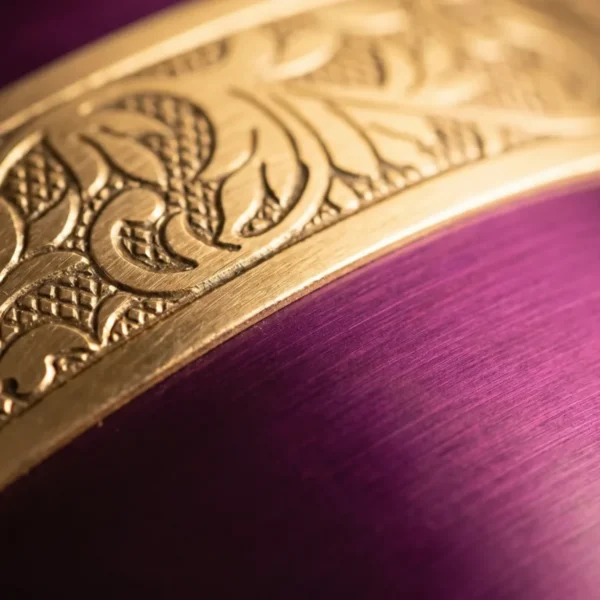 Close-up of the gold engraving on the plum cremation urn