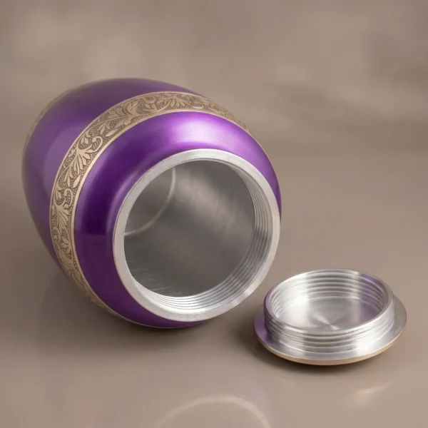 purple gold cremation urn with lid off showing the silver screw thread inside the neck