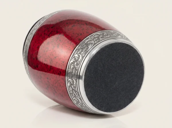 Red cremation urn base with protective charcoal felt bottom