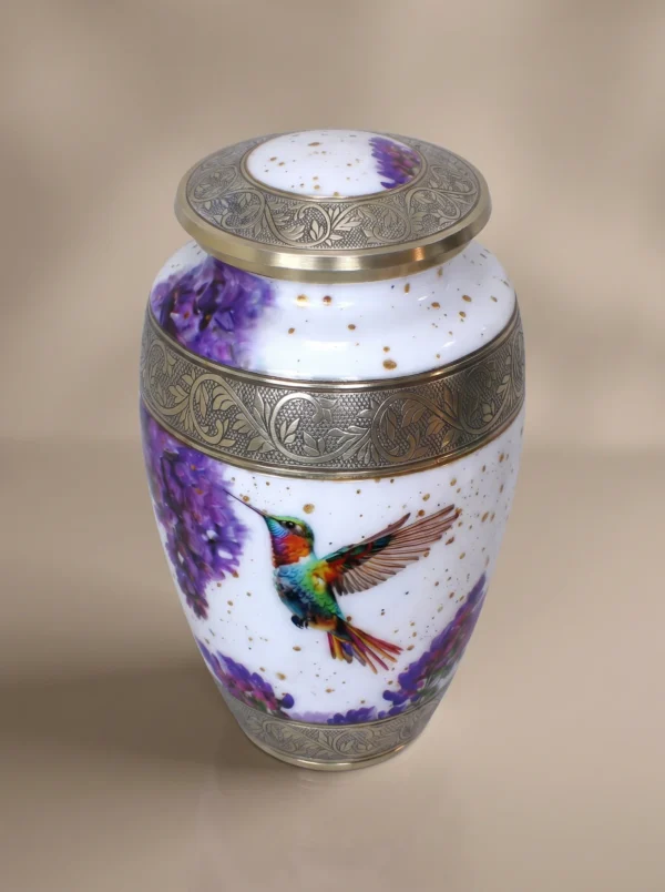 Hummingbird cremation urn three-quarter angle showing lid and silver banding
