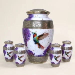 White and gold hummingbird cremation urn family set with four matching keepsakes