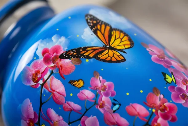 Close-up of the hand-painted butterflies, pink blossoms and silver engraved band