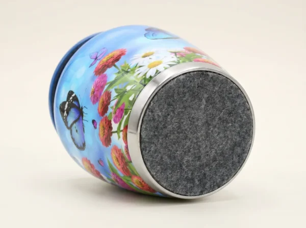 Base of a blue butterfly keepsake urn with a protective felt bottom