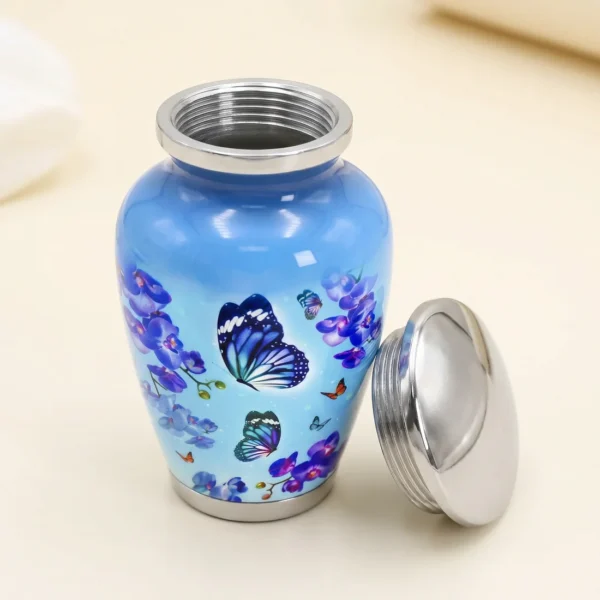 Blue butterfly keepsake urn with the lid removed showing the silver threaded neck