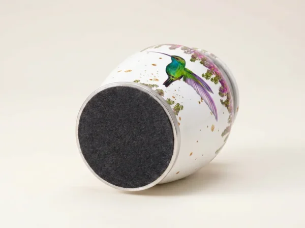 Base of a white hummingbird keepsake urn with a protective felt bottom
