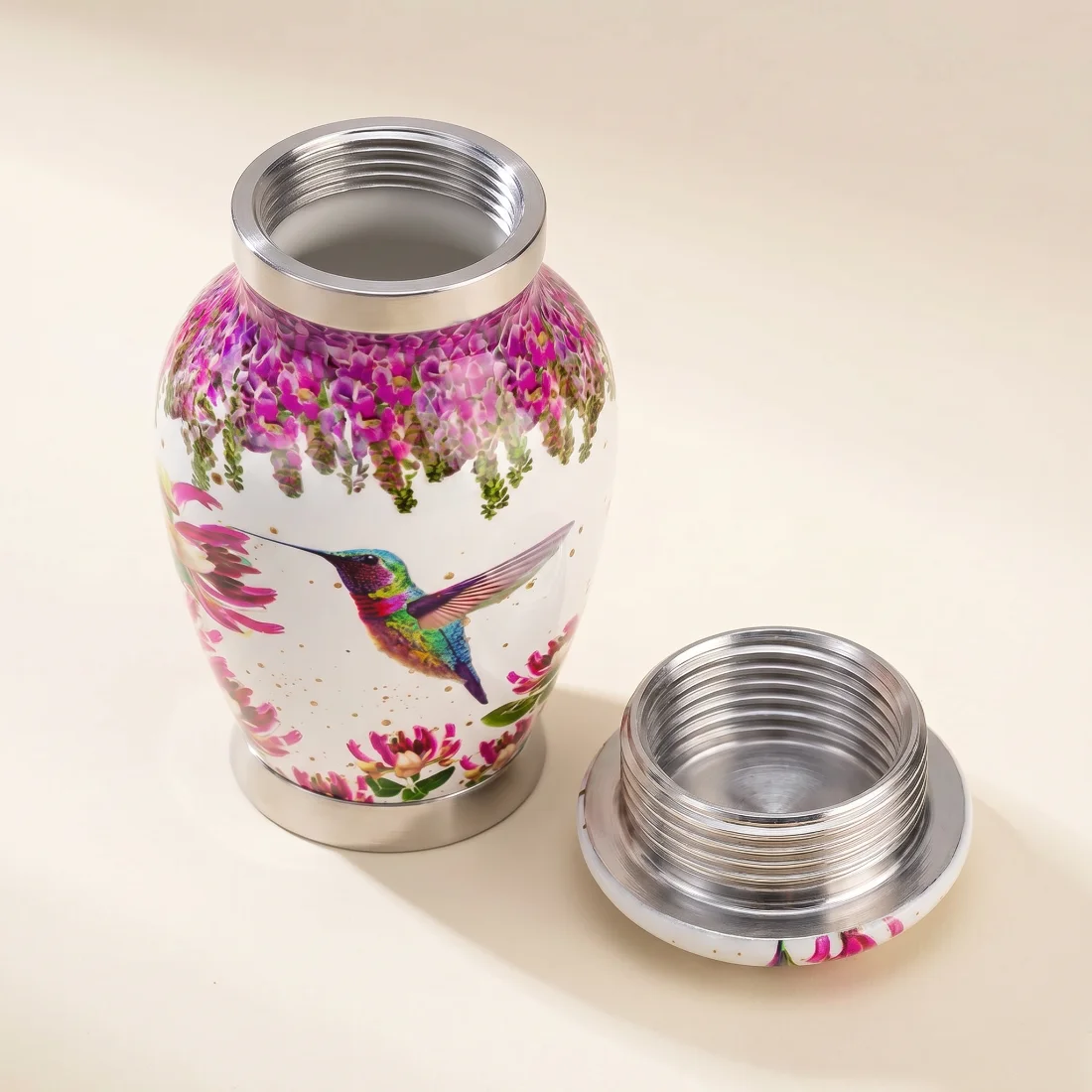 White hummingbird keepsake urn with the silver threaded lid removed