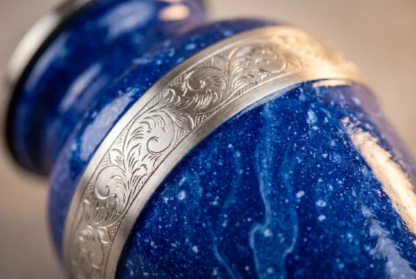 Close-up of the blue speckled enamel finish and silver engraved band