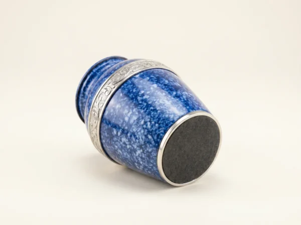 Base of a blue speckled enamel keepsake urn with a protective felt bottom