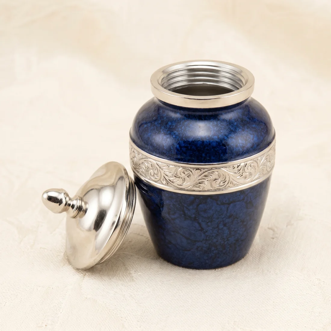 Multicolour keepsake urn with the silver threaded lid removed