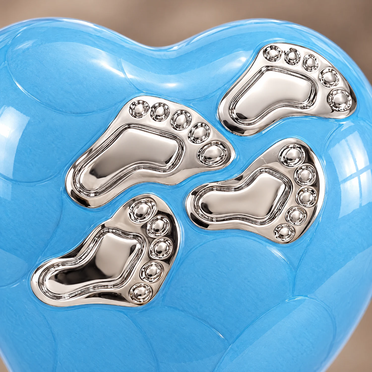 Close-up of the hand-finished detail on the Blue Enamel baby heart-shaped keepsake urn