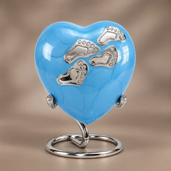 Blue Enamel baby heart-shaped keepsake urn shown upright against a soft neutral studio background