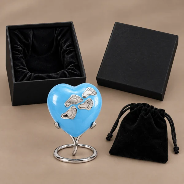 Blue enamel baby heart keepsake urn with its stand, velvet pouch and black presentation box