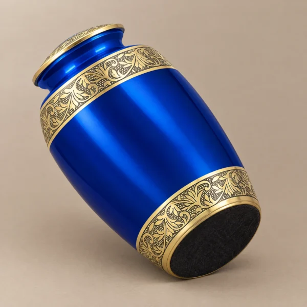 Felt-lined base of the blue and gold metallic cremation urn