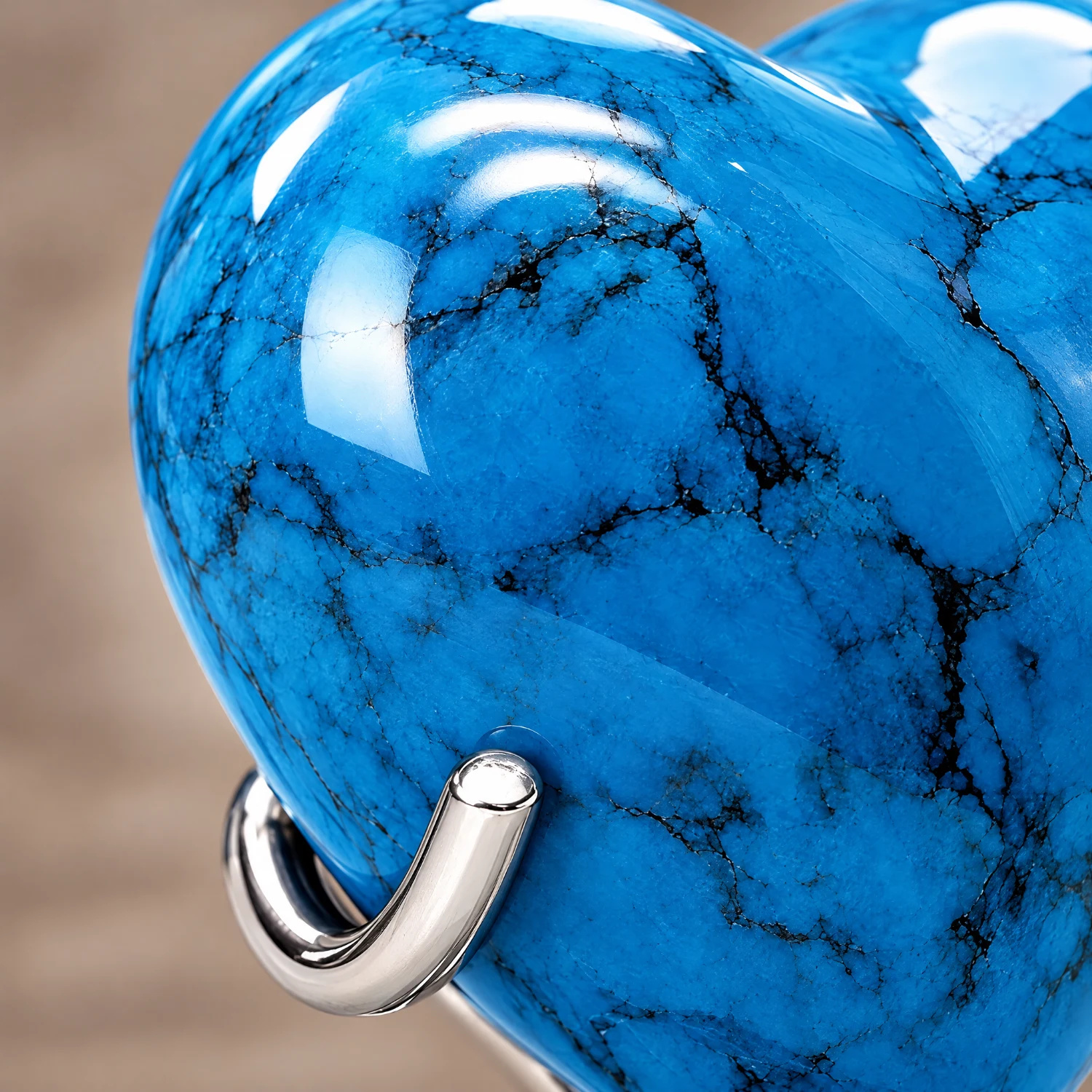 Close-up of the hand-finished detail on the Blue Stone heart-shaped keepsake urn