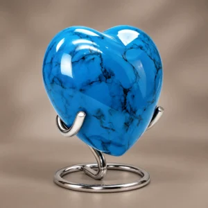 Blue Stone heart-shaped keepsake urn shown upright against a soft neutral studio background
