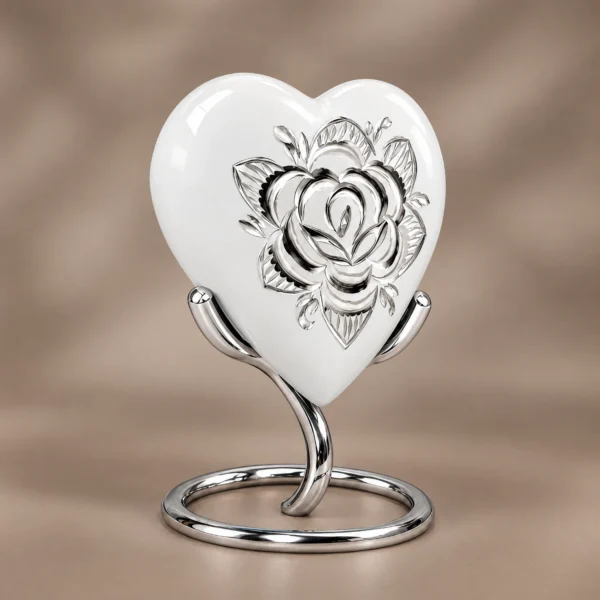 White rose heart keepsake urn on its stand from a three-quarter angle