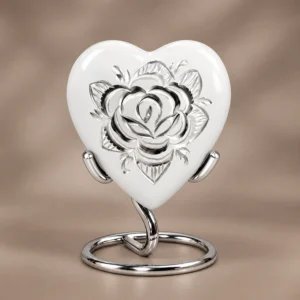 White Rose heart-shaped keepsake urn shown upright against a soft neutral studio background